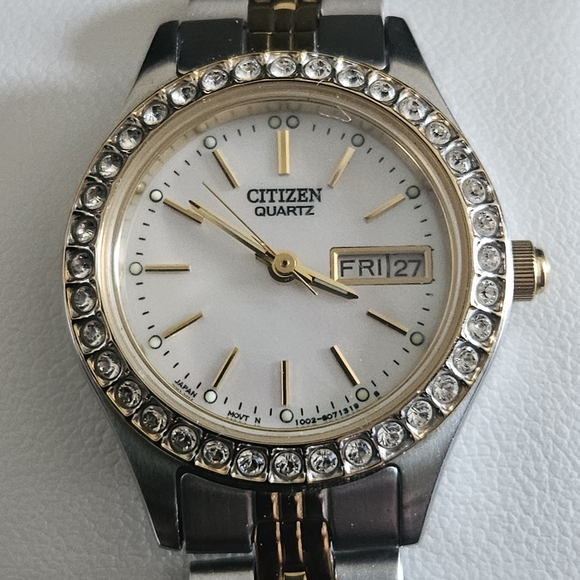 Citizen Quartz Watch with Gold Accents and Silver Band